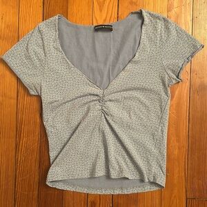 Brandy Melville light blue short sleeve shirt with daisies, size XS/S